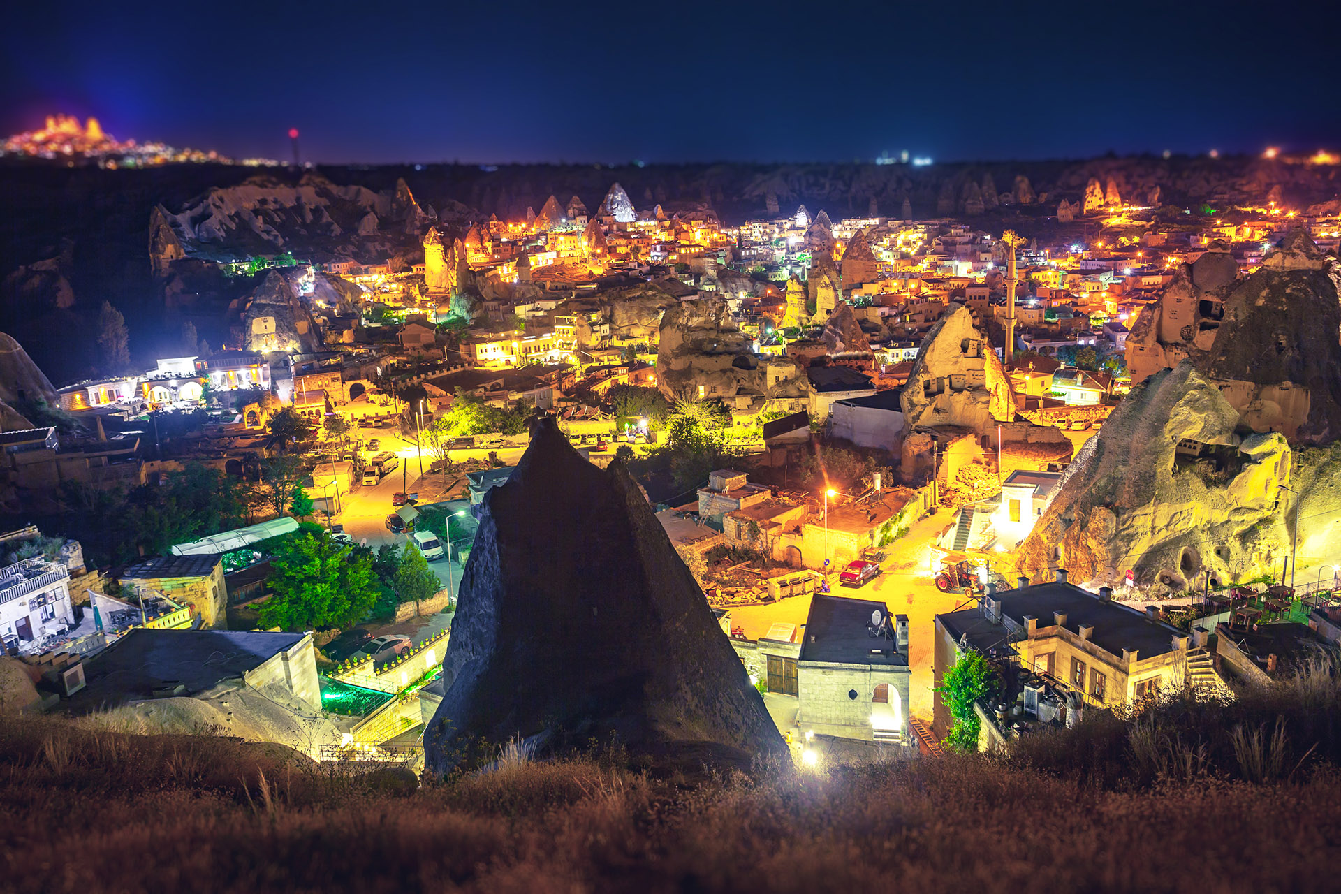 Ancient town and castle of Uchisar dug mountains, Cappadocia at night, Turkey