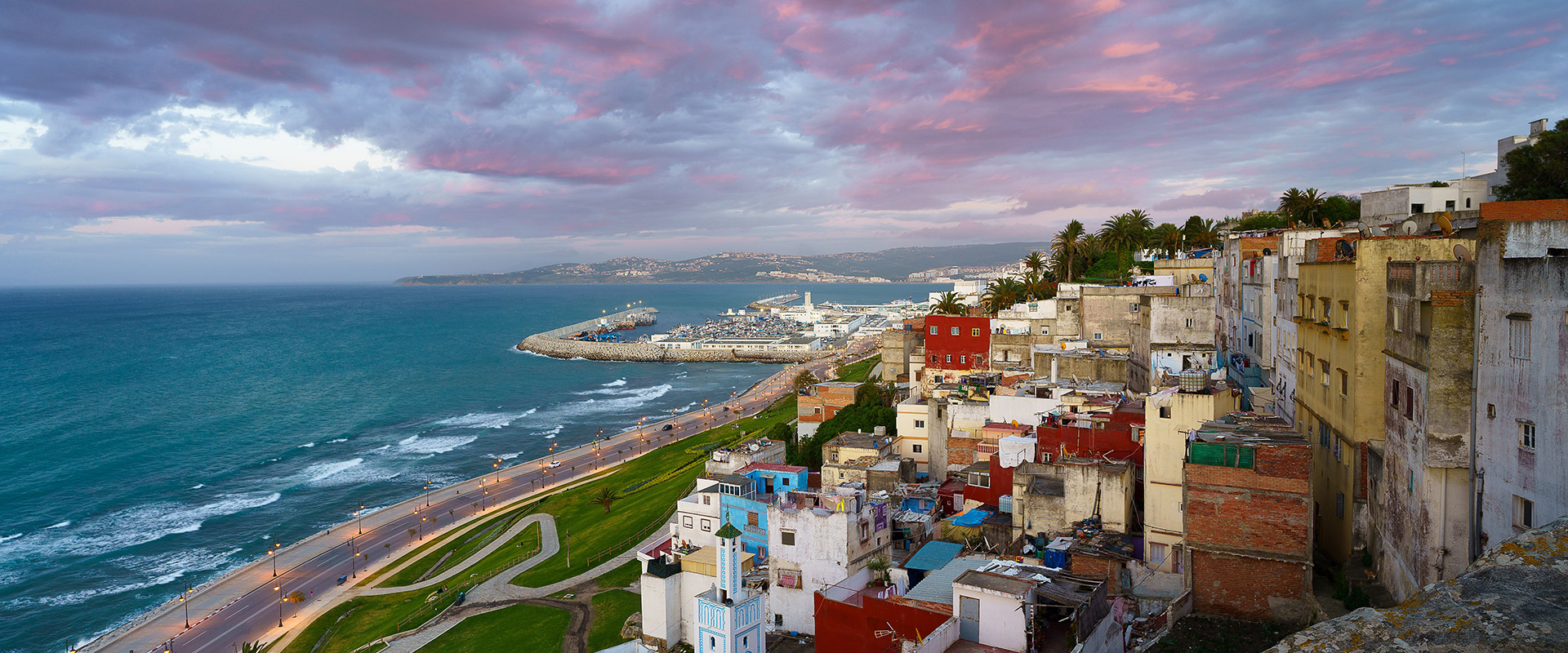 An aerial view of cityscape Tangier surrounded by buildings and water